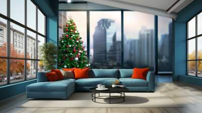 Christmas tree in modern office near big window and building view in city Wall mural