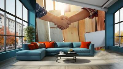 Close up view of two workers shaking hands after successful deal, Craftsman concept Wall mural