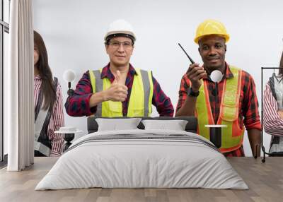 portrait group of multi ethnic engineers wears safety helmet and glow shirt showing happy smiles aga Wall mural