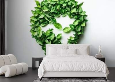 A creative representation of sustainability with a light bulb made of green leaves, symbolizing eco-friendly innovation. Wall mural