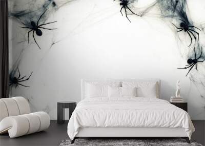 A spooky Halloween background with black spiders and cobwebs surrounding a white space. Wall mural