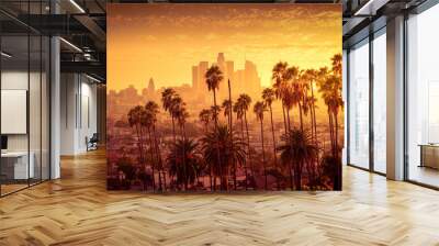 Beautiful sunset of Los Angeles downtown skyline and palm trees in foreground Wall mural