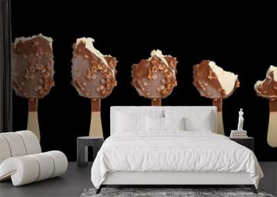 Ice cream in different stages of eating. Isolated on black backg Wall mural