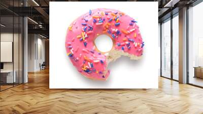 Pink frosted donut with colorful sprinkles with bite missing Wall mural