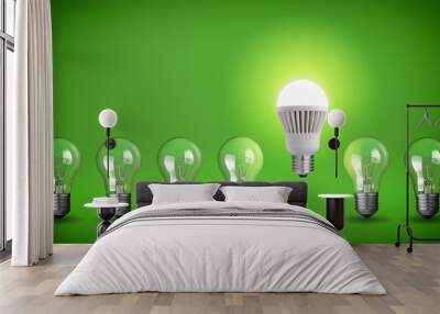 Row of light bulbs.Idea concept on green background. Wall mural