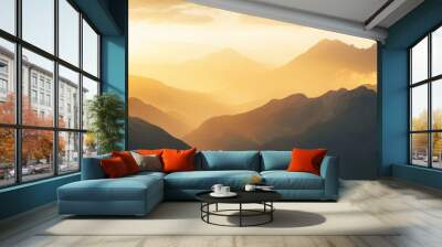 A breathtaking view of a mountain range at sunrise, with golden light illuminating the peaks and valleys. Wall mural