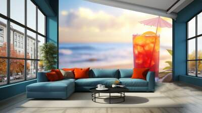 A tropical cocktail with a paper umbrella, set against a beach background. Wall mural