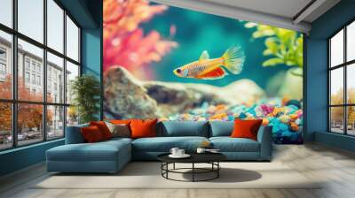 Guppy fish exploring a tank with colorful gravel and live plants Wall mural