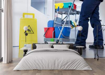 Worker janitor Mopping Floor In Office with trolley Wall mural