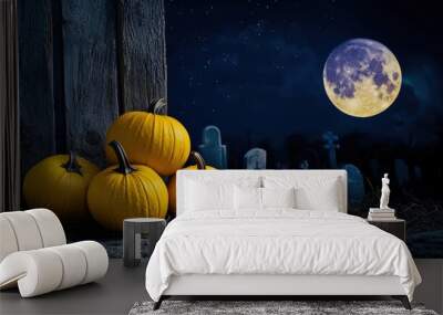 Chilling cemetery landscape lit by lemon-colored pumpkins under a periwinkle moon. Wall mural