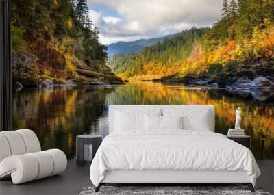 A rainbow of fall colors is reflected in the smooth Rogue River while white water rafting with some amazing friends Wall mural