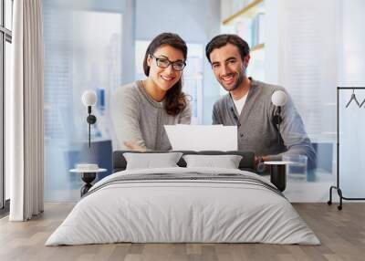 Portrait of man and woman working together in office Wall mural