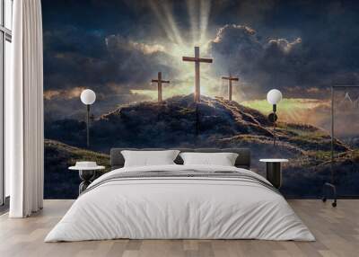 3 Crosses on a hill with sun rays and clouds in the background Wall mural