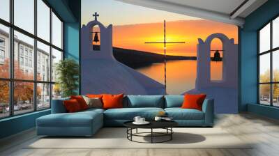 A cross in the foreground of a gorgeous sunset in Santorini, Greece Wall mural