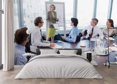 Businesswoman talking in meeting Wall mural