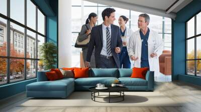 Doctors and administrators talking in hospital Wall mural