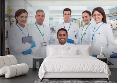 Scientists smiling in laboratory Wall mural