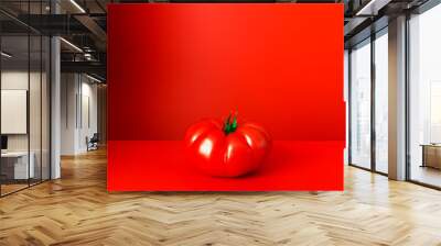 Tomato sitting on red counter Wall mural