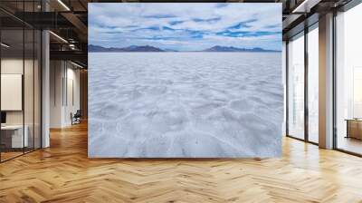 Scenic view of Bonneville Salt Flats in western Utah with Silver Island Mountains peaks in the background, Wendover, USA, America. Densely packed salt pans and natural landscape near Salt Lake City Wall mural