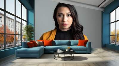 Studio headshot of beautiful young Latina business woman with room for copy. Wall mural