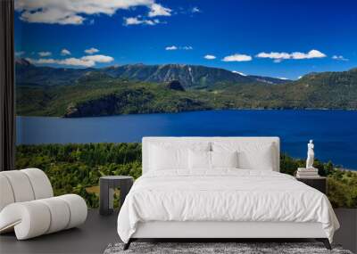 Landscape of lake Lacar, San martin de los Andes, Neuquen, Argentina. Taken on a warm summer afternoon under a ble sky with a few white clouds  Wall mural