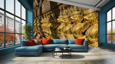 Row of golden garudas at Wat Phra Kaew in Bangkok Wall mural