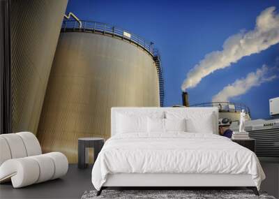 oil gas and workers with large industrial storage tanks Wall mural