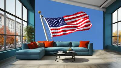 American Flag Blowing in the Wind with Blue Sky Wall mural