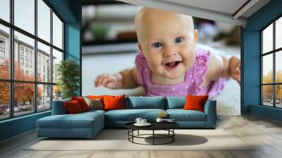 happy 6 month old baby girl learning to crawl Wall mural