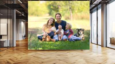 Happy Family Laughing Together with Dog Outside Wall mural