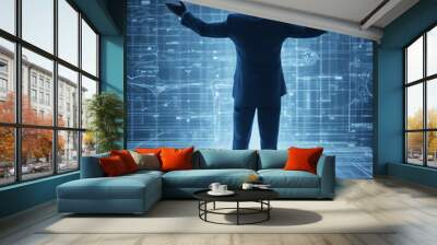 Silhouette of a human in suit raising his hands in front of a digital diagram. Wall mural