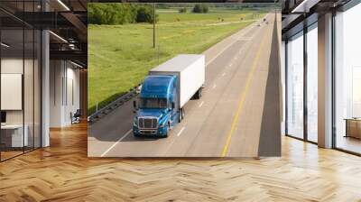 Blue Semi Truck Trailer Rig Hauls Freight on Divided Highway Wall mural