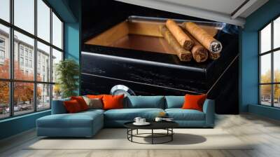 Cigars on a humidor against a black background Wall mural