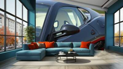 Sports car with helicopter in background Wall mural