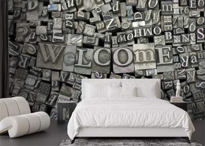 Close up of typeset letters with the word Welcome Wall mural