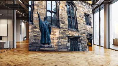 Statue of protestant reformer John Knox near Edinburgh University, Scotland Wall mural