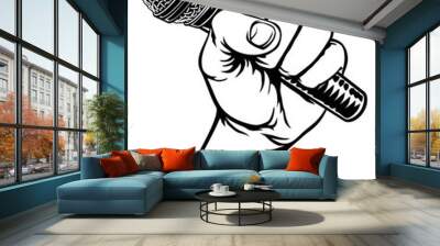 A fist hand holding a microphone or mic in a vintage intaglio woodcut engraved or retro propaganda style Wall mural