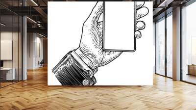 A hand holding a mobile phone in a business suit in a vintage old woodcut etching style Wall mural