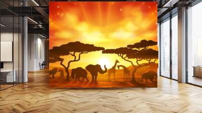 An African savannah landscape scene with safari animal silhouettes Wall mural