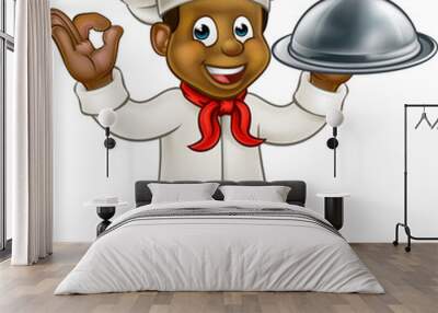 Cartoon black chef or baker character holding a silver cloche food meal plate platter and giving a perfect okay delicious cook gesture Wall mural