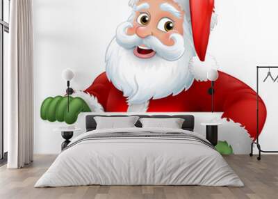 Santa Christmas cartoon character peeking over a sign and pointing at it Wall mural