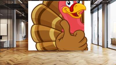 Turkey Thanksgiving or Christmas bird animal cartoon character peeking around a background sign giving a thumbs up Wall mural