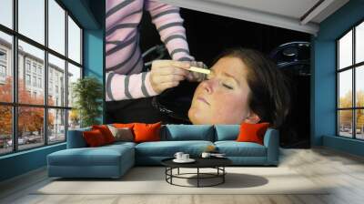 waxing her eyebrows Wall mural