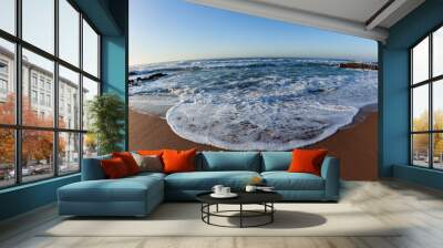 Beach sand ocean sea wave wash close up wide angle photo in morning light of nature's coastline detail. Wall mural