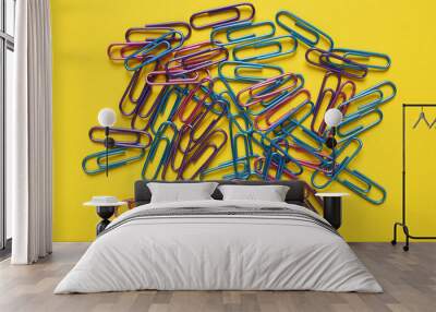 office paper clips on yellow background Wall mural