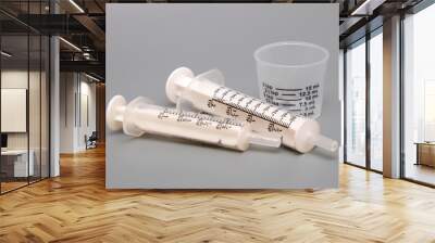 Oral medicine syringes and medicing dosing cup Wall mural