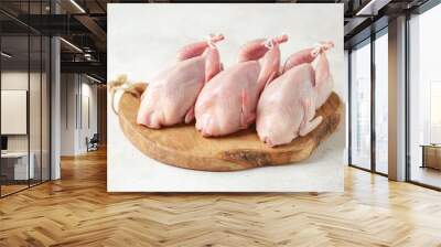 Fresh raw quail on a light background. Organic food. Wall mural