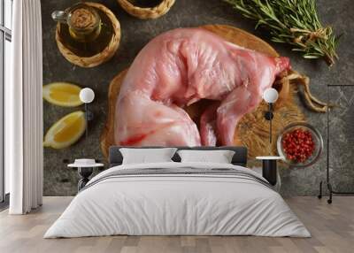 Fresh raw rabbit with rosemary, pink pepper and sea salt. Wall mural