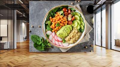 Healthy vegetarian salad with chickpeas, quinoa, cherry tomatoes, cucumber, radish, spinach, avocado and parsley. Ketogenic diet. Top view.  Wall mural