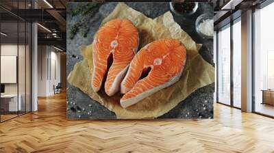 Two fresh raw salmon steaks on a gray concrete background. Healthy food. Top view. Copy space.  Wall mural